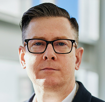 Alexander Hughes, executive and CEO at a crypto trading company, portrait